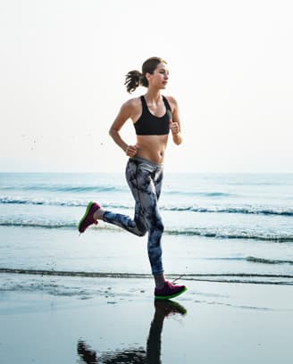 Athletic person silhouetted in a gym